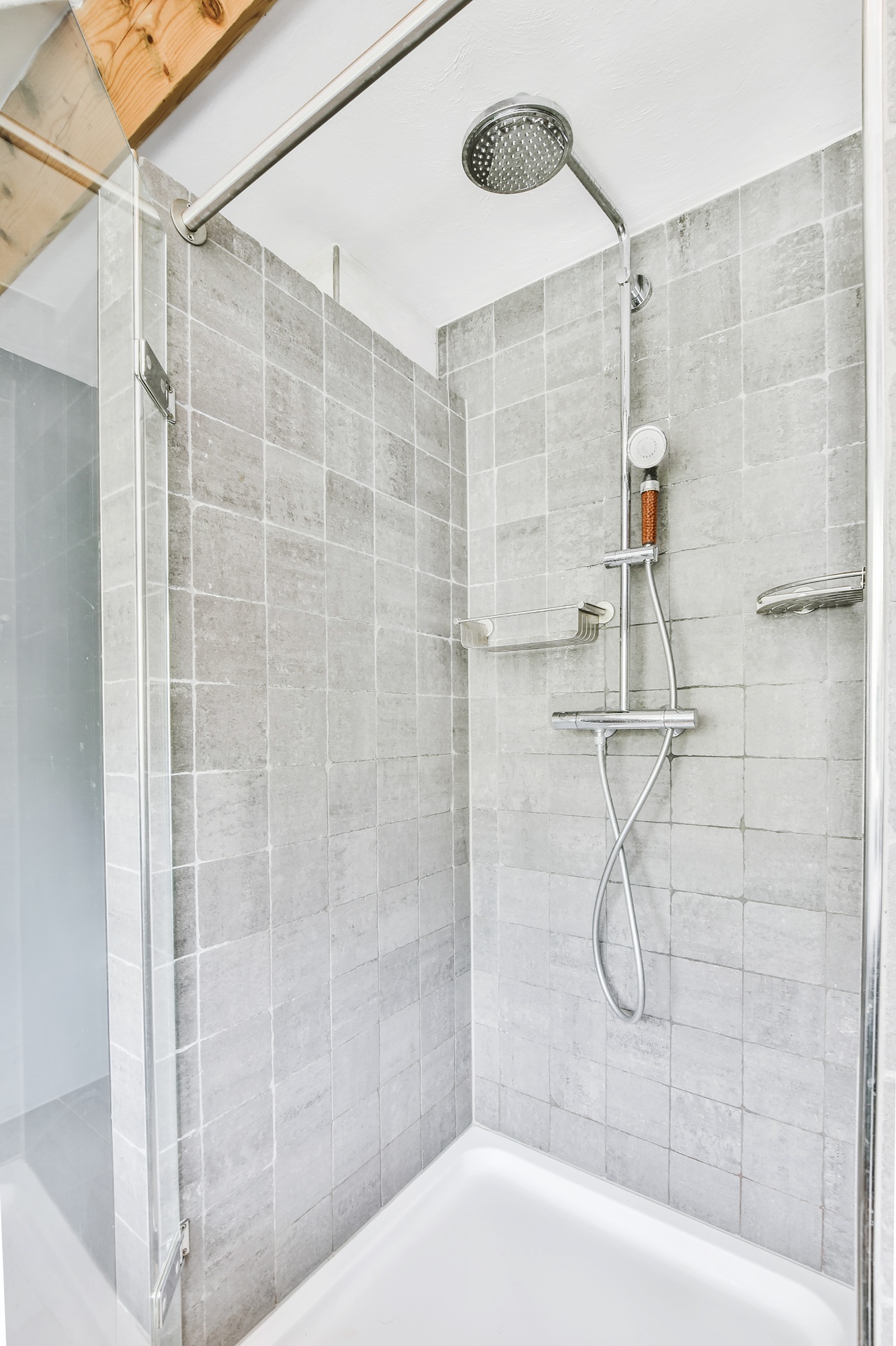 Shower tap in tiled bathroom